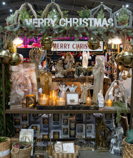Merry Christmas decor including holly nad large Christmas signs and holiday angel decor
