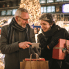 A couple standing and talking in a Christmas market