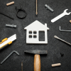 an image of a house surrounded by tools and work equipment