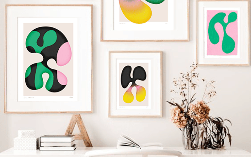 White wall with custom DIY psychedelic art in clean white frames on the wall