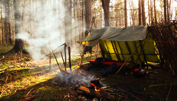 Essentials For Outdoor Survival Shelter in a forest