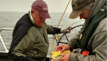 Fall Crabbing Two men on a boat