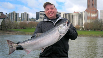Ready For June A man holding a large fish