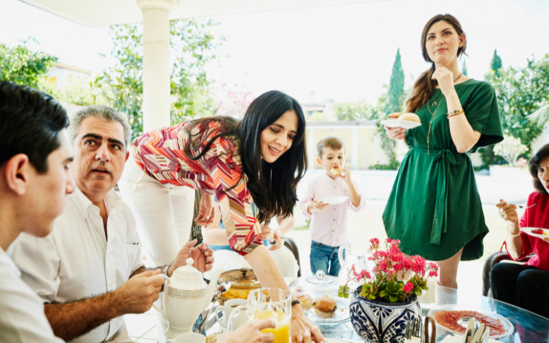 Family enjoying an outdoor backyard breakfast 