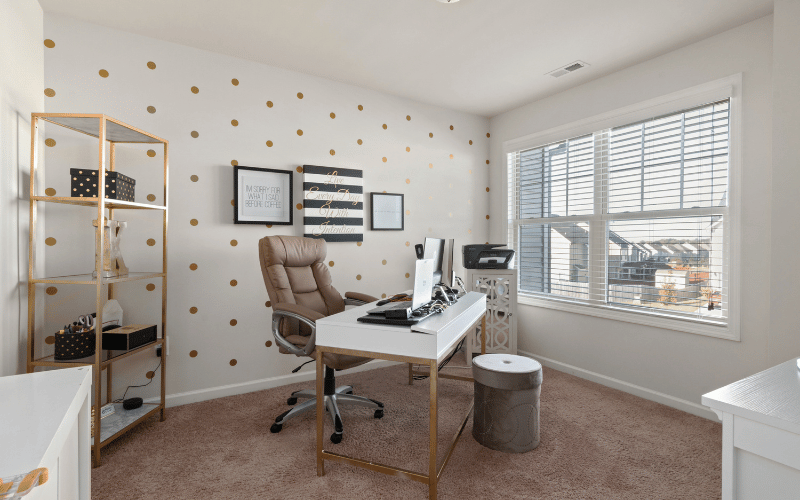 Home office with big white designed room, gold storage, thoughtful layout and big open windows
