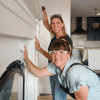 Leslie Davis and Lyndsay Lamb standing next to a wall