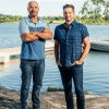 Bryan Baeumler and Scott McGillIvray standing near a lake