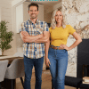 Scott McGillivray and his wife standing outside of a house