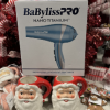 BaBylissPRO® Nano Titanium ™ Dryer in front of Christmas Tree behind Santa mugs