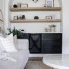 large home living room with black cupboard and white couch.