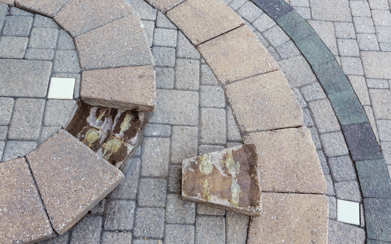 Broken patio stones on front step of house