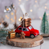 Close up of mini red car decor piece with gingerbread cookies on top