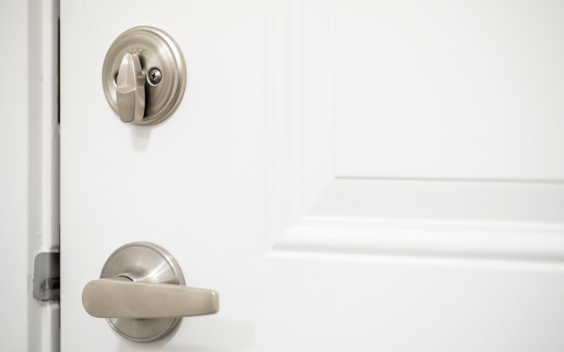 White door with silver dead bolts