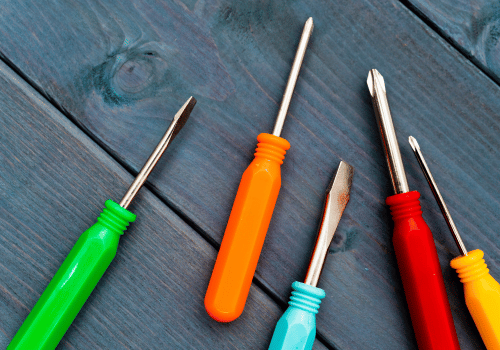 Colorful screwdriver set on wooden background