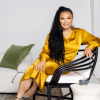 Egypt Sherrod wearing shiny yellow dress thumbnail photo