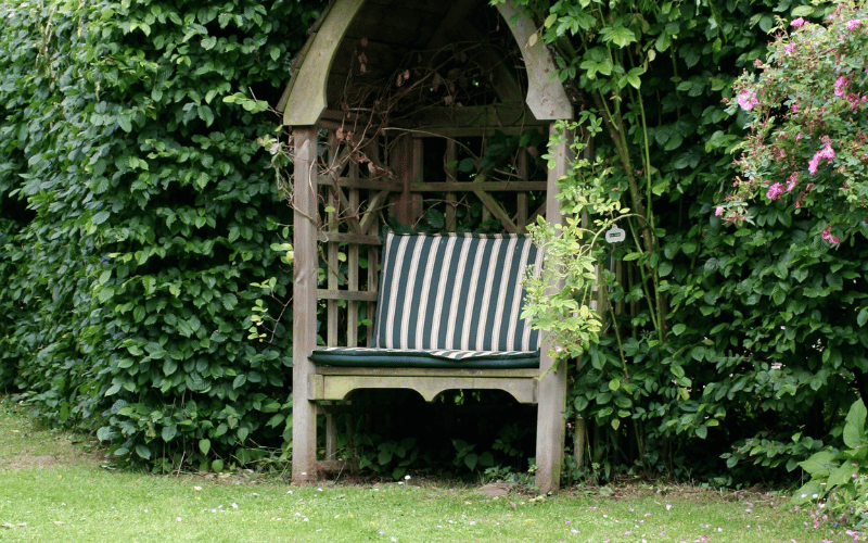 Wooden Garden Chair in garden with green and neutral vertical stripes