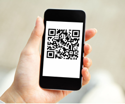 hand holding cell phone displaying QR code