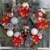 holiday wreath with nutcracker in the middle. Red and white theme