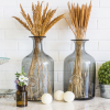 Interior decor kitchen pieces including dried flowers in glass vases