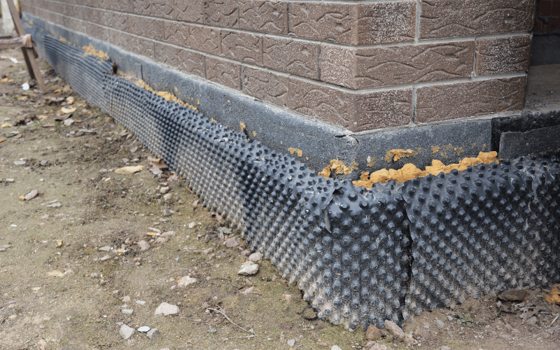 protective covering around the bottom of a brick house to prevent pests from entering