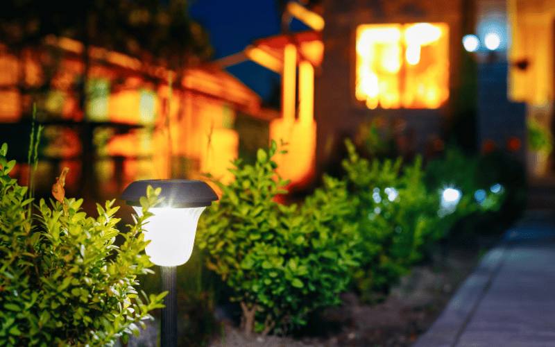 Garden lights beside a path way at night. 