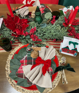 Beautiful red and green Christmas tablescape on a dining room table