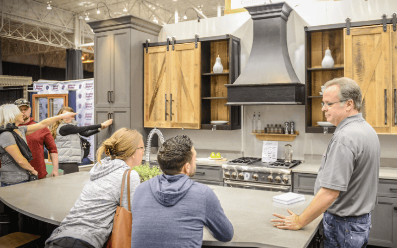Couple speaking to a contractor about a custom kitchen at the fall atlanta home show