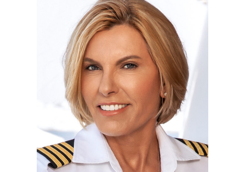 Captain Sandy Yawn wearing ship captain uniform smiling for photo