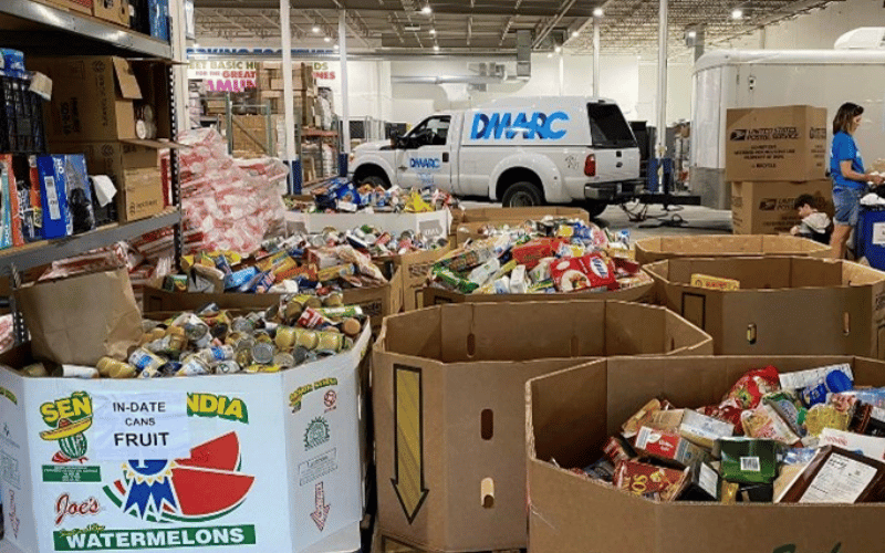 Many cardboard boxes filled with boxed and canned foods 