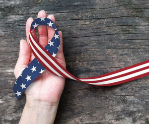 American ribbon in hand
