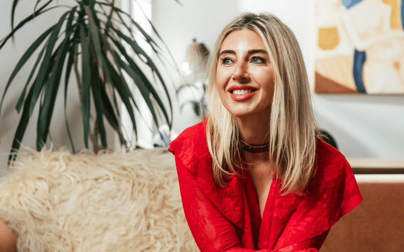 Virgina Chamlee wearing a red blazer 