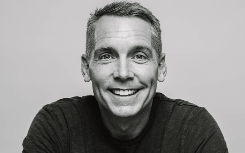 black and white photograph of man smiling 