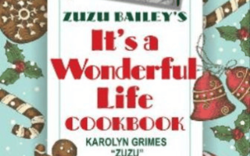 the cook image of a cook book with candy canes and gingerbread men on the front 
