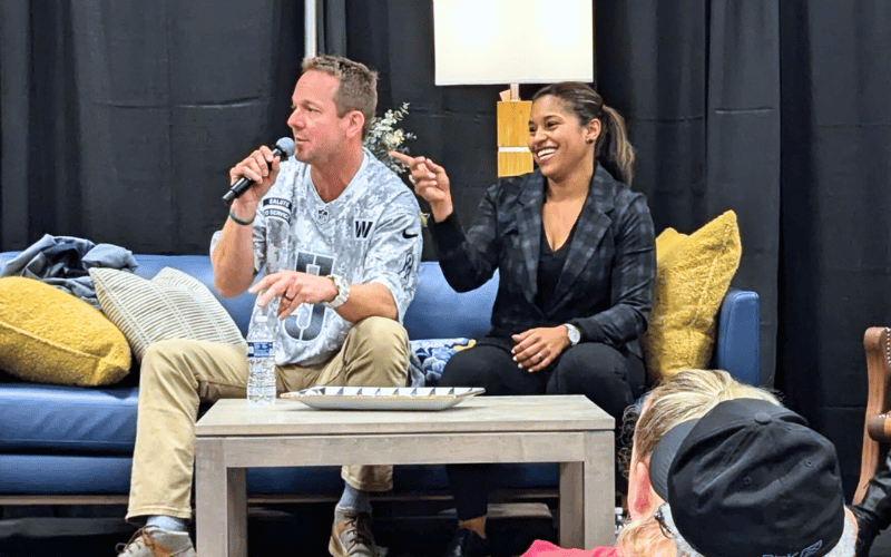 Brian and Mika Kleinschmidt speaking on stage 