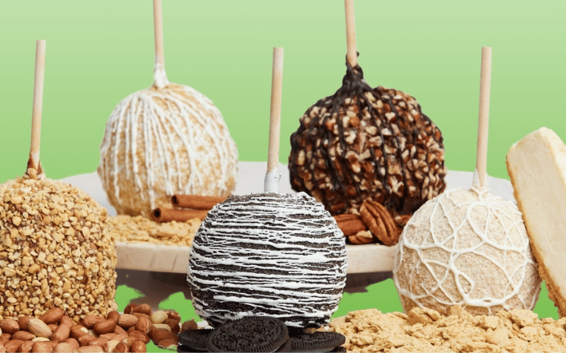 Candied apples coated with chocolate and nuts 