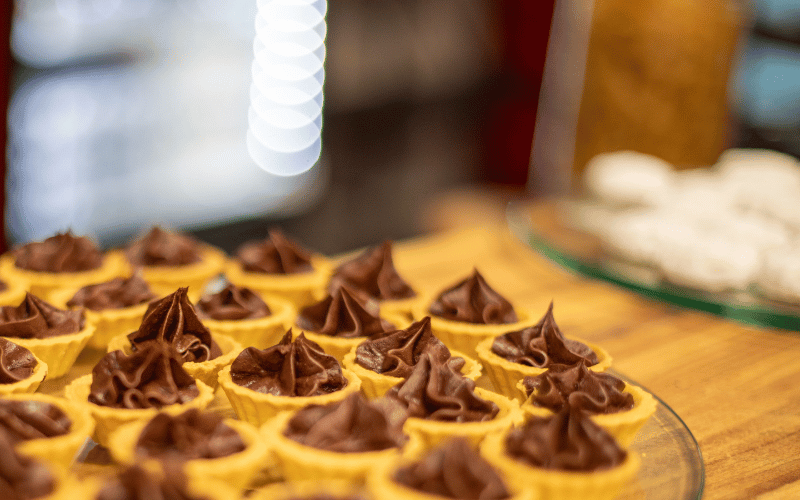 2 mini chocolate tarts on a serving tray