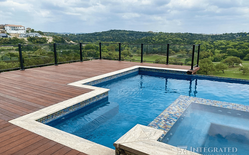 an infinity pool overlooking a forest 