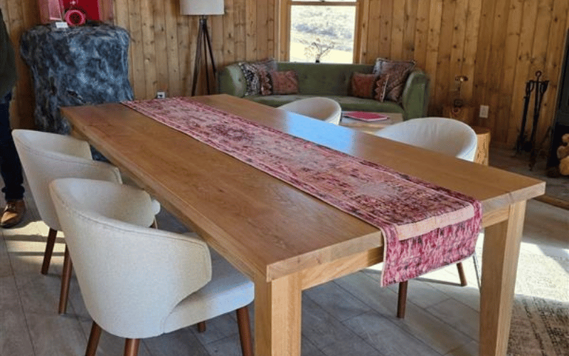 wooden table with red table runner