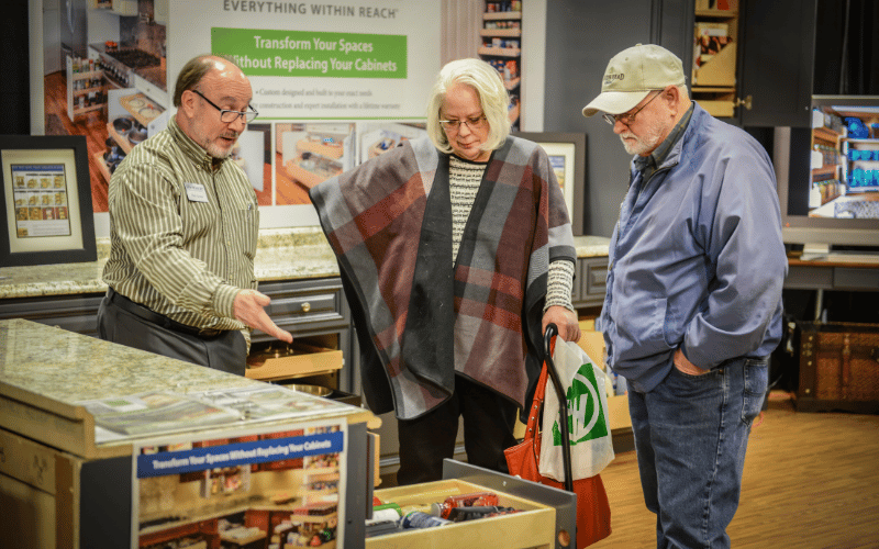 man helping older couple pick out countertops at the Atlanta Home Show