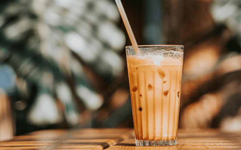 iced coffee in a glass with a straw