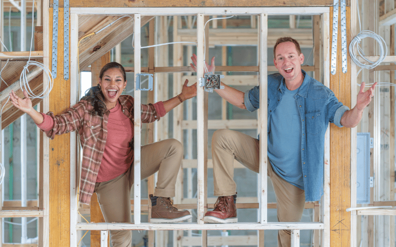 Brian and Mika Kleinschmidt on a home construction site 
