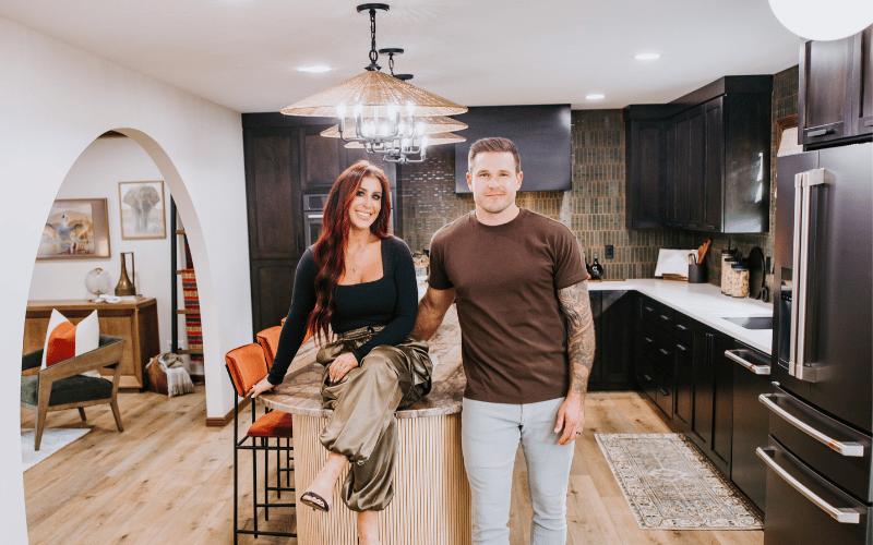 Chelsea and Cole DeBoer in a large kitchen