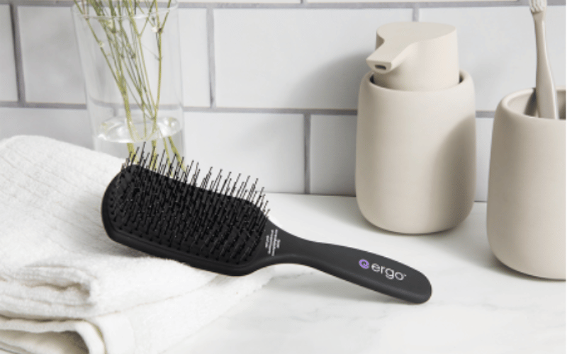 Ergo Stying Tools Brush on a bathroom counter