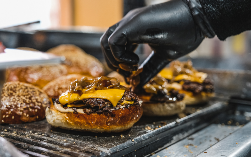 Making smash burgers at home on cast iron grill