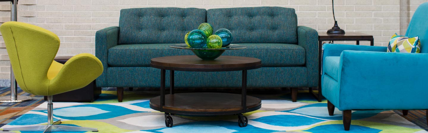 living room with teal sofa