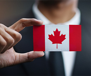 Public Servant Day A person holding a Canadian flag
