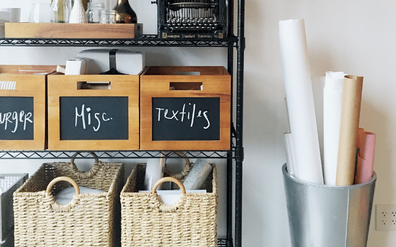 Labelled boxes and bins on a storage shelf