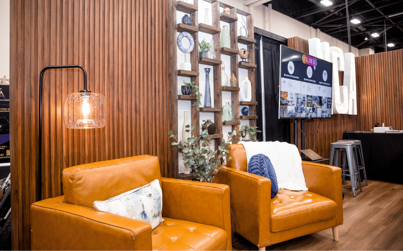 Unused spaces brown leather furniture Unused spaces brown leather furniture with layered lighting, comfy pillows and wall shelving unit
