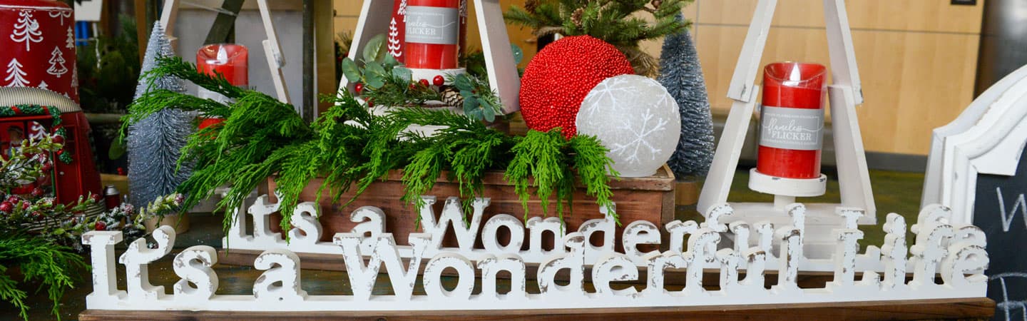 white wooden It's A Wonderful Life sign